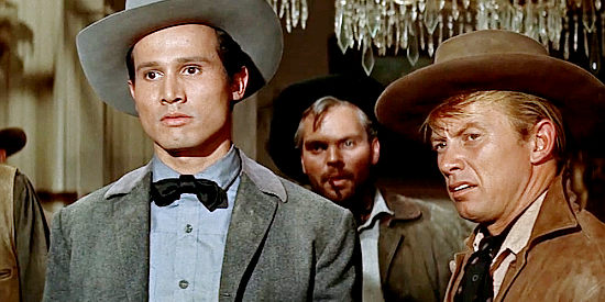 Henry Silva as Sam Teeler and one of his men listen to Joe Maybe's idea that they postpone a bank robbery in Ride a Crooked Trail (1958)