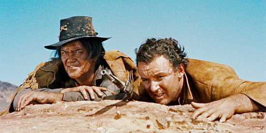 Jay C. Flippen as Walking Coyote and Rod Steiger as O'Meara, watching a Sioux attack in Run of the Arrow (1957)