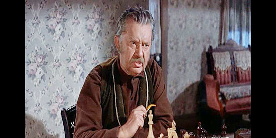 Jean Hersholt as Mr. Swenson, Helga's dad, scolding her for not being able to focus on their game of chess in Run for Cover (1955)