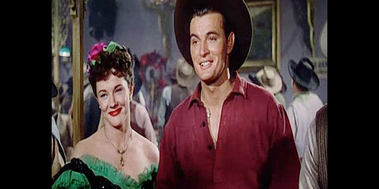 Jeanne Cooper as saloon girl Myra, who falls for settler Hal Jessup (Gregg Palmer) in The Redhead from Wyoming (1953)