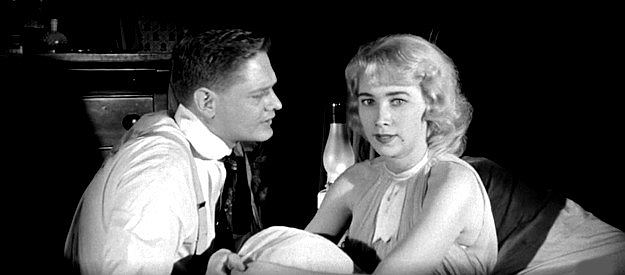 Jodean Russo (aka Jodean Lawrence) as Ruby Potter, telling husband Melvin (Charles Veltmann Jr.) she expects him to make her rich in Revenge of the Virgins (1959)