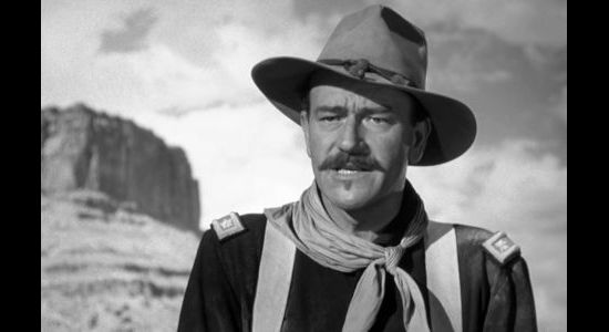 John Wayne as Lt. Col. Kirby Yorke, frustrated by his inability to pursue his enemy into Mexico in Rio Grande (1950)