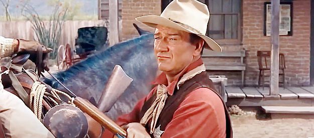 John Wayne as Sheriff John T. Chance discusses his situation with old friend Pat Wheeler in Rio Bravo (1959)