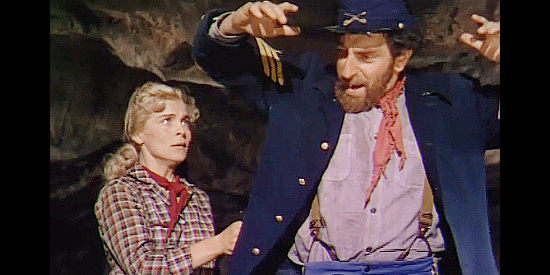 Lizabeth Scott as Chris, taking charge of Sgt. Skee (Jeff Corey), a rude Rebel dressed in Yankee blue in Red Mountain (1951)