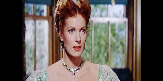 Maureen O'Hara as Kate Maxwell, finding herself at the heart of Jim Averall's scheme to become governor of Wyoming in The Redhead from Wyoming (1953)
