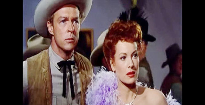 Alex Nicol as Sheriff Blaine and Maureen O'Hara as Kate Maxwell, reacting to the sound of gunfire in The Redhead from Wyoming (1953)