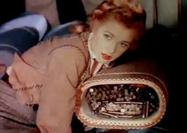Audrey Long as Claire Conville, discovering concealed ammunition in a freight wagon in Cavalry Scout (1951)