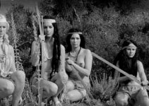 Nona Carver as Yellow Gold with part of the Golden Horde, watching the gold-hunting party advance in Revenge of the Virgins (1959)