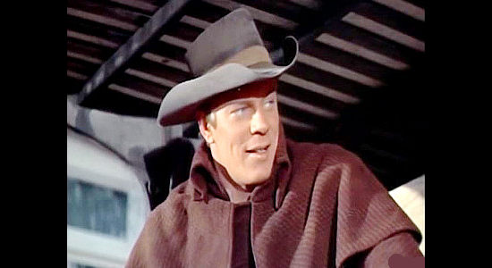 Peter Graves as Capt. Frank Dwyer, arriving in St. Albans and pretending to be a traveling peddler in The Raid (1954)