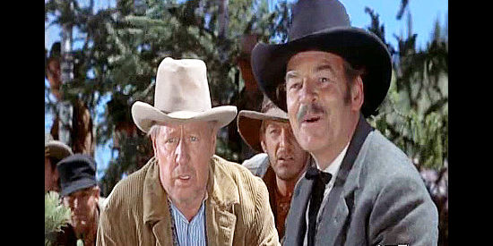 Ray Teal (right) as the sheriff, mistakenly thinking he's spotted outlaws while townsman Scotty (Irving Bacon) looks on in Run for Cover (1955)