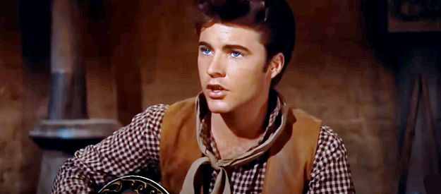 Ricky Nelson as Colorado Ryan, the young gun who eventually winds up wearing a deputy's badge in Rio Bravo (1959)