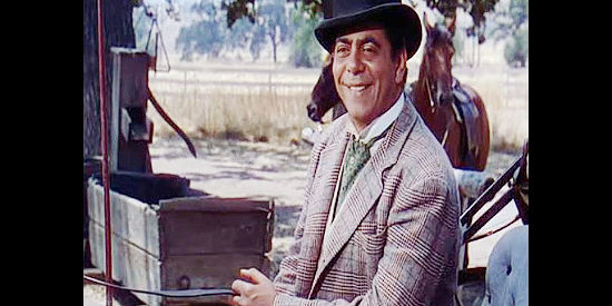 Robert Strauss as Knuckles Hogan, Kate Maxwell's business associate and protector in The Redhead from Wyoming (1953)