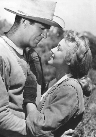 Rod Cameron as Kirby Frye with Audrey Long as Claire Conville in Cavalry Scout (1951)