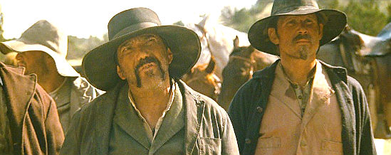 Steven Michael Quezada as Alonzo, the bounty hunter's tracker in Outlaws and Angels (2016)