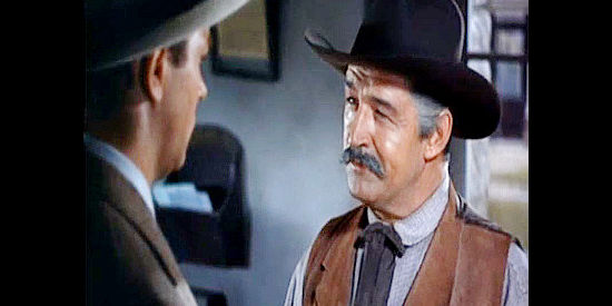Ted de Corsia as Sheriff Parker, warning King Cameron (Howard Keel) of the difficulty he's about to face in Ride, Vaquero! (1953)