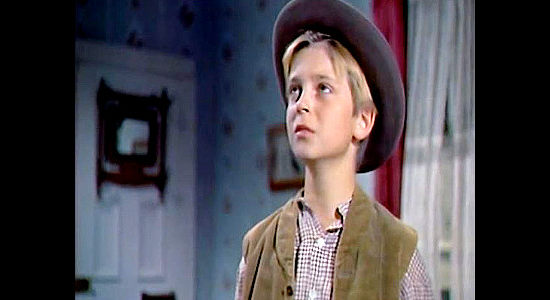 Tommy Rettig as Larry Bishop, Katy's son, realizing the man he's looked up to is a Confederate officer in The Raid (1954)