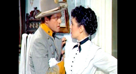 Van Heflin as Maj. Neal Benton, trying to advise Katy Bishop of the dangers during the Rebel raid of St. Albans in The Raid (1954)