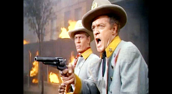 Van Heflin (right) as Maj. Neal Benton and Peter Graves as Capt. Frank Dwyer, preparing to flee the town they've attacked in The Raid (1954)