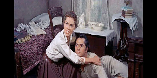 Viveca Lindfors as Helga Swenson, trying to comfort Davey Bishop (John Derek) when he learns he's been crippled in Run for Cover (1955)