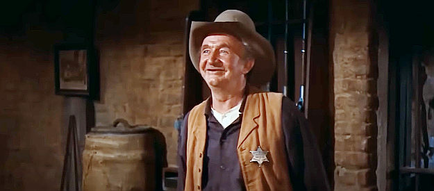 Walter Brennan as Stumpy, trying his best to keep the sheriff and the other deputies in line in Rio Bravo (1959)