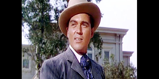 William Bishop as Jim Averall, the man with his eyes on the Wyoming governorship in The Redhead from Wyoming (1953)