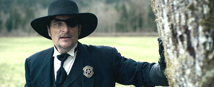 Kim Coates as U.S. Marshal Woody Calhoun in Stagecoach (2016)