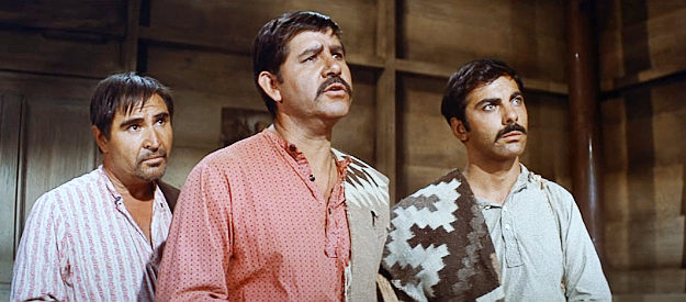 Pepe Hern as Tomas, Jorge Martinez de Hoyoes as Hilario and Natividad Vacio as a villager, looking for guns or hired guns in The Magnificent Seven (1960)