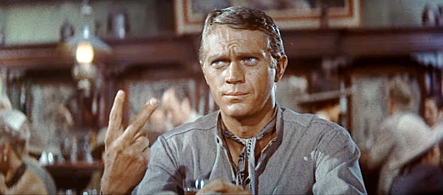 Steve McQueen as Vin Tanner, signaling his willingness to become one of Chris's hired guns in The Magnificent Seven (1960)