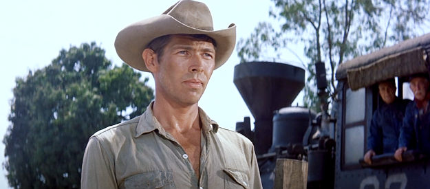 James Coburn as Britt, about to show off his skill with a knife in The Magnificent Seven (1960)