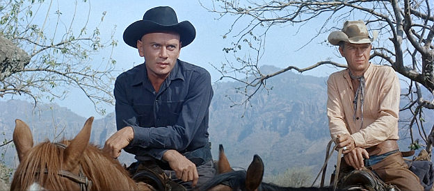 Yul Brynner as Chris Adams and Steve McQueen as Vin Tanner, looking down on the Mexican village in The Magnificent Seven (1960)