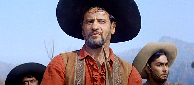 Eli Wallach as Calvera, a bandit with 40 guns riding behind him in The Magnificent Seven (1960)