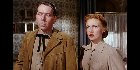 Alexander Knox as Will Isham with Joan Leslie as Laurie, his new wife, in Man in the Saddle (1951)