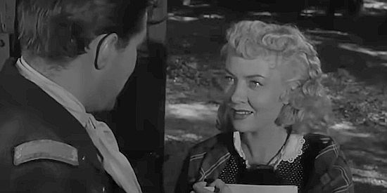 Audrey Totter as mail-order-bride Flaxy, getting to know Lt. Faraday better in Massacre Canyon (1954)