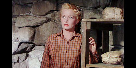 Ellen Drew as Nan Melotte, about to watch Hugh Clagg and Owen Merritt duke it out in Man in the Saddle (1951)