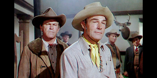 Guinn Williams as Bourke Prine and Randolph Scott as Owen Merritt in Man in the Saddle (1951)