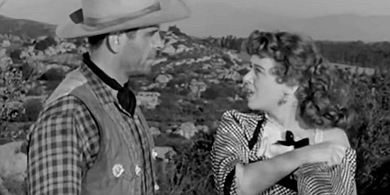 Jeff Donnell as Cora, a mail-order-bride meeting Sgt. Marlow (Douglas Kennedy) for the first time in Massacre Canyon (1954)