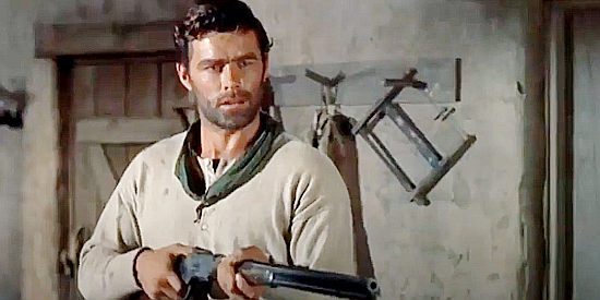 Jeff Richards as Corey Everett, suspicious of everyone who wanders in his valley in The Marauders (1955)