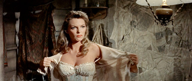 Julie London as Billie Ellis, stripping at an outlaw's command in Man of the West (1958)