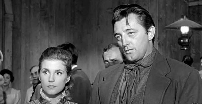 Karen Sharpe as Stella Atkins and Robert Mitchum as Clint Tolliver in Man with the Gun (1955)