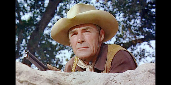 Randolph Scott as Owen Merritt, striking back at Will Isham's ranch in Man in the Saddle (1951)