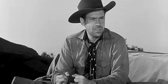 Ross Elliott as George Davis, once accused of cowardice and now surrounded by warring Indians in Massacre Canyon (1954)