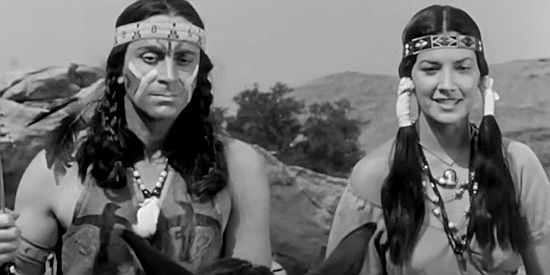 Steven Ritch as Black Eagle and Charlita as Gita, hoping their ploy to infiltrate the caravan works in Massacre Canyon (1954)