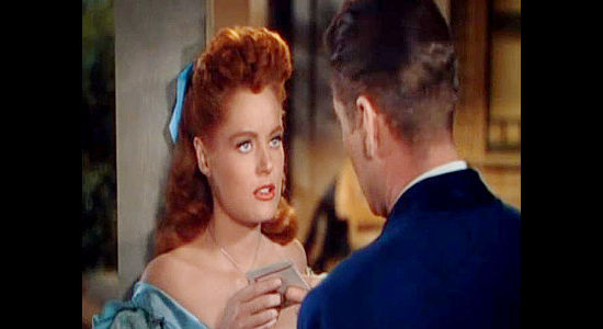 Alexis Smith as Maria Singleton, baffled as Morgan Lane returns the lease on her land in Montana (1950)