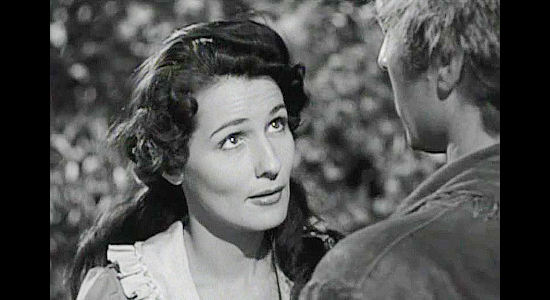 Brenda Marshall as Marion Thorne, coming to rely upon Nat Cutler for her survival in a harsh new world in The Iroquois Trail (1950)