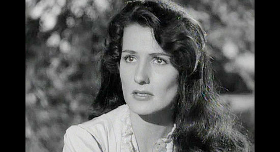 Brenda Marshall as Marion Thorne, insisting on a reunion with her father in spite of the danger in The Iroquois Trail (1950)