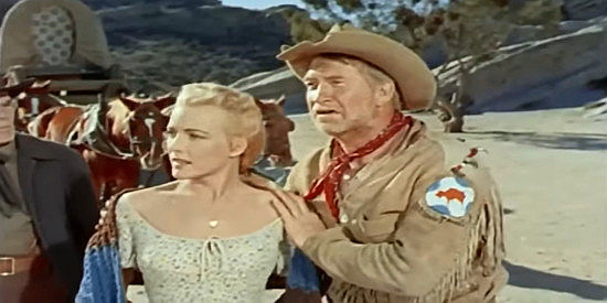 Cathy Downs as Amy Connors and Chill Wills as Tobias Taylor, arguing against giving any rifles to the Comanche in Kentucky Rifle (1956)