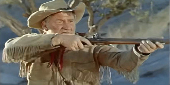 Chill Wills as Tobias Taylor, trying to win a game of markmanship with the rifle he's named Betsy in Kentucky Rifle (1956)