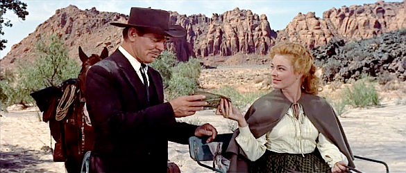 Clark Gable as Dan Kehoe with a potential partner, Eleanor Parker as Sabina in The King and Four Queens (1956)