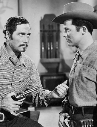 Clayton Moore as Deputy George Ives and Lon McCallister as John Malvin in Montana Territory (1952)