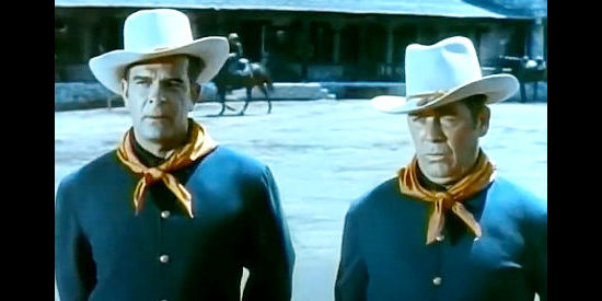 Douglas Kennedy as Trooper Emmers and William Haade as Trooper Riorty, newcomers with a questionable past in Oh! Susanna (1951)